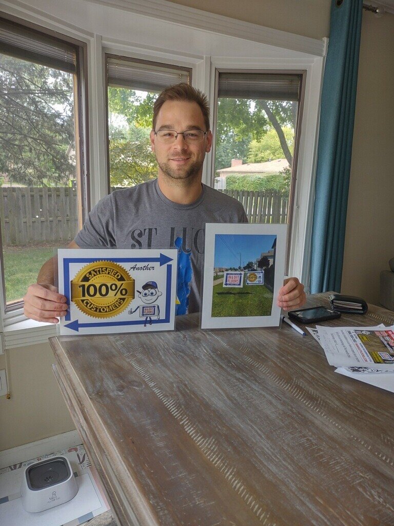 Deck Last customer displaying his 100% satisfied customer sign and yard sign photo
